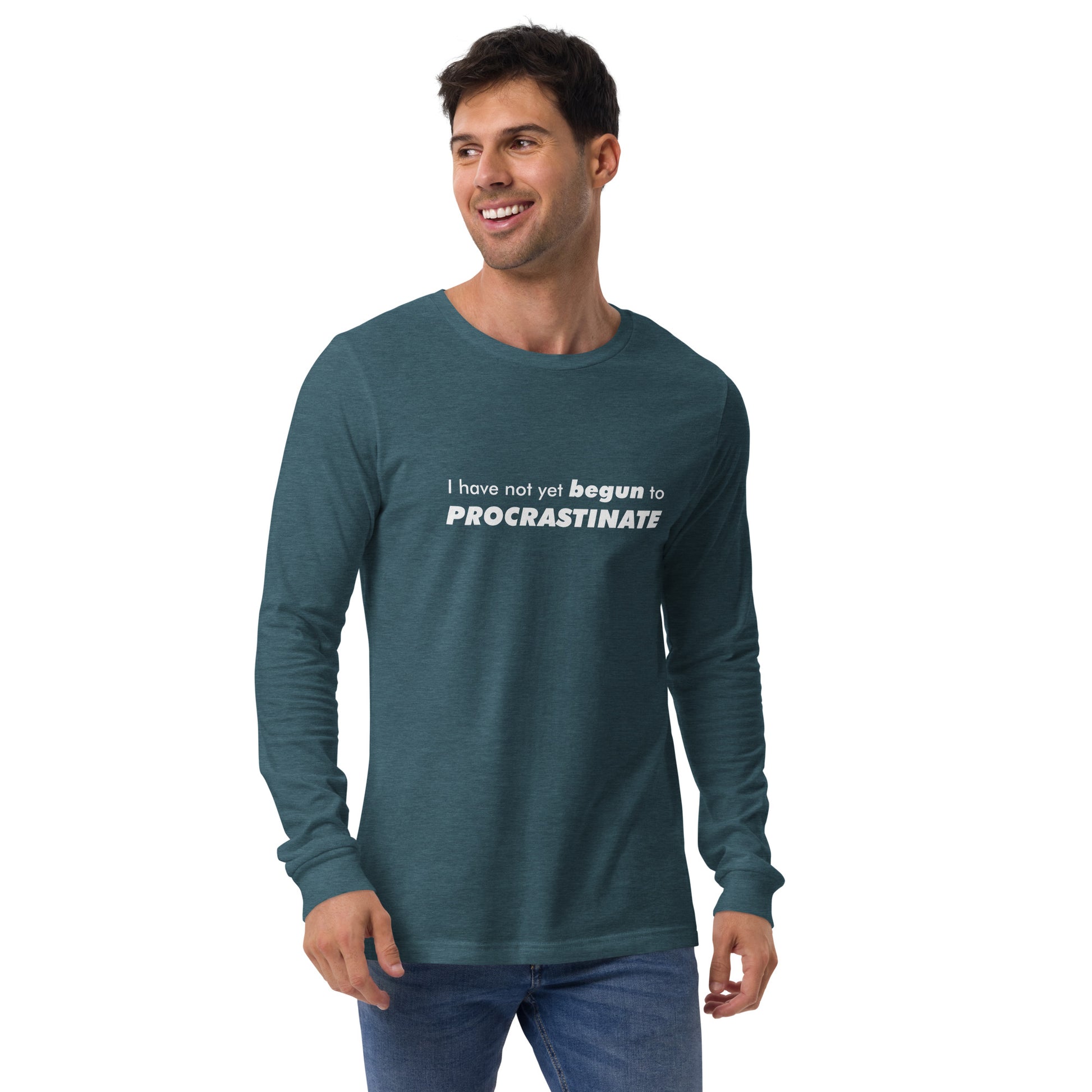 Male model wearing Heather Deep Teal long-sleeve shirt with text graphic: "I have not yet BEGUN to PROCRASTINATE"