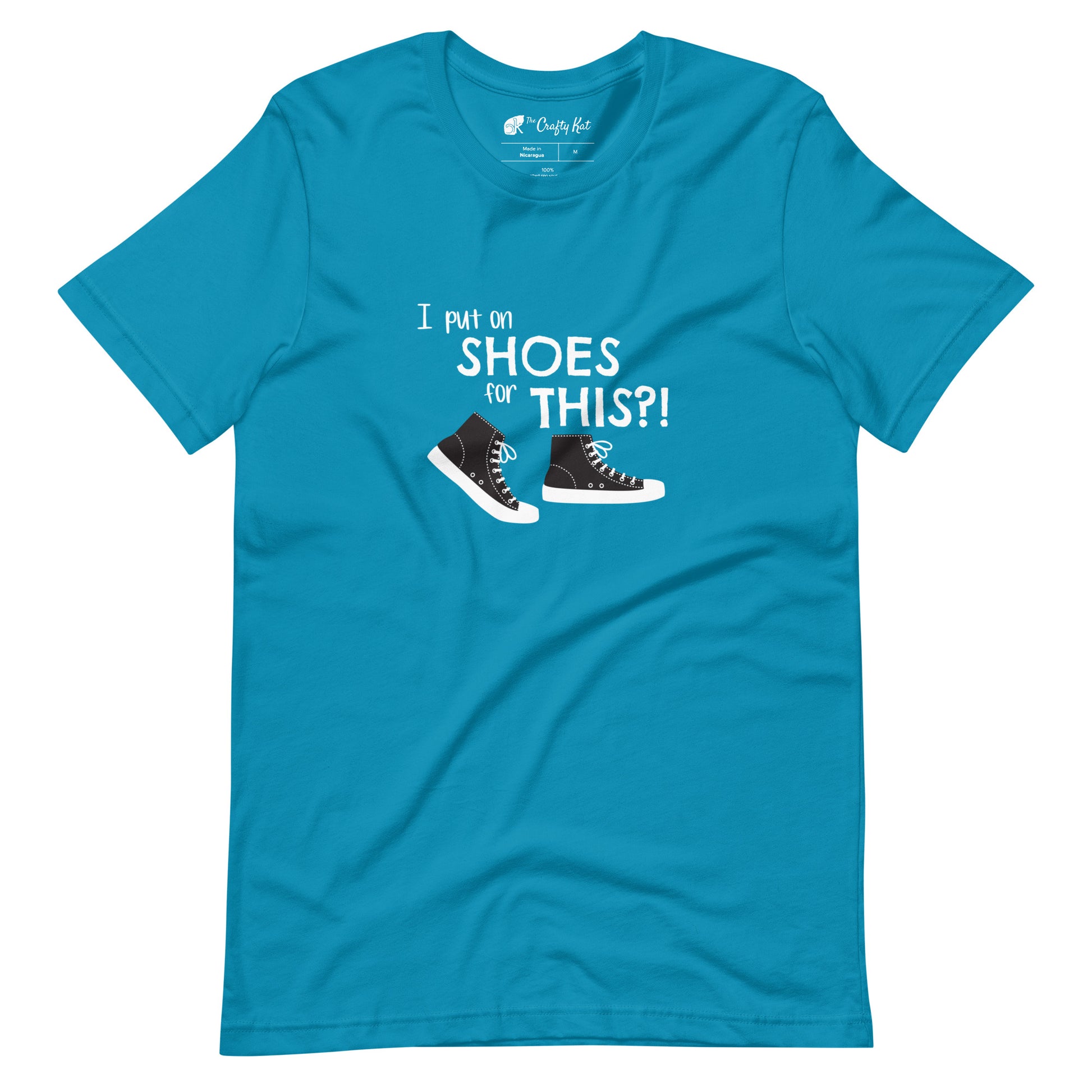 Aqua (cyan) t-shirt with graphic of black and white canvas "chuck" sneakers and text: "I put on SHOES for THIS?!"