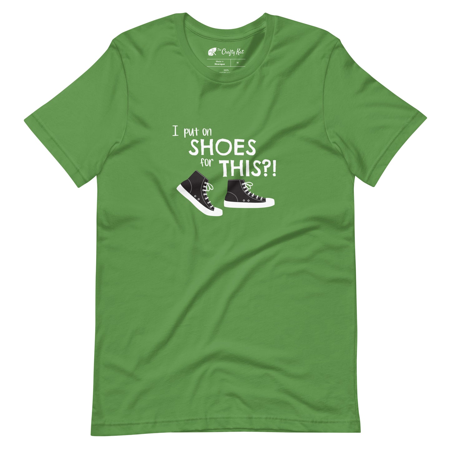 Leaf green t-shirt with graphic of black and white canvas "chuck" sneakers and text: "I put on SHOES for THIS?!"