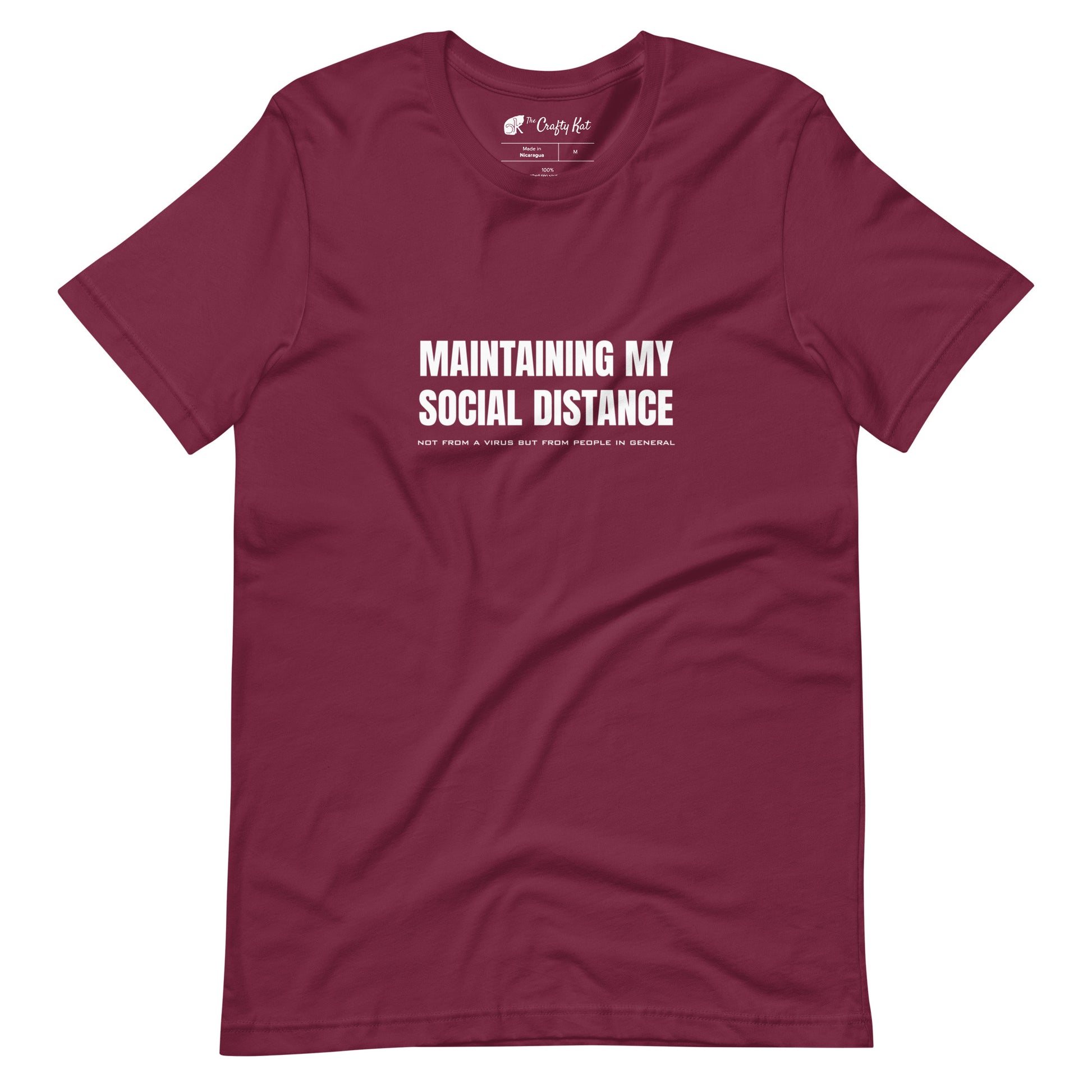 Maroon t-shirt with white graphic: "MAINTAINING MY SOCIAL DISTANCE not from a virus but from people in general"