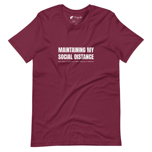 Maroon t-shirt with white graphic: "MAINTAINING MY SOCIAL DISTANCE not from a virus but from people in general"