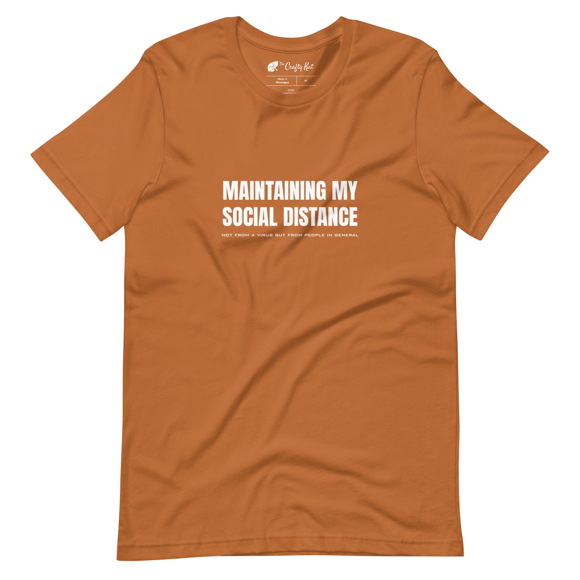 Toast (yellow orange) t-shirt with white graphic: "MAINTAINING MY SOCIAL DISTANCE not from a virus but from people in general"