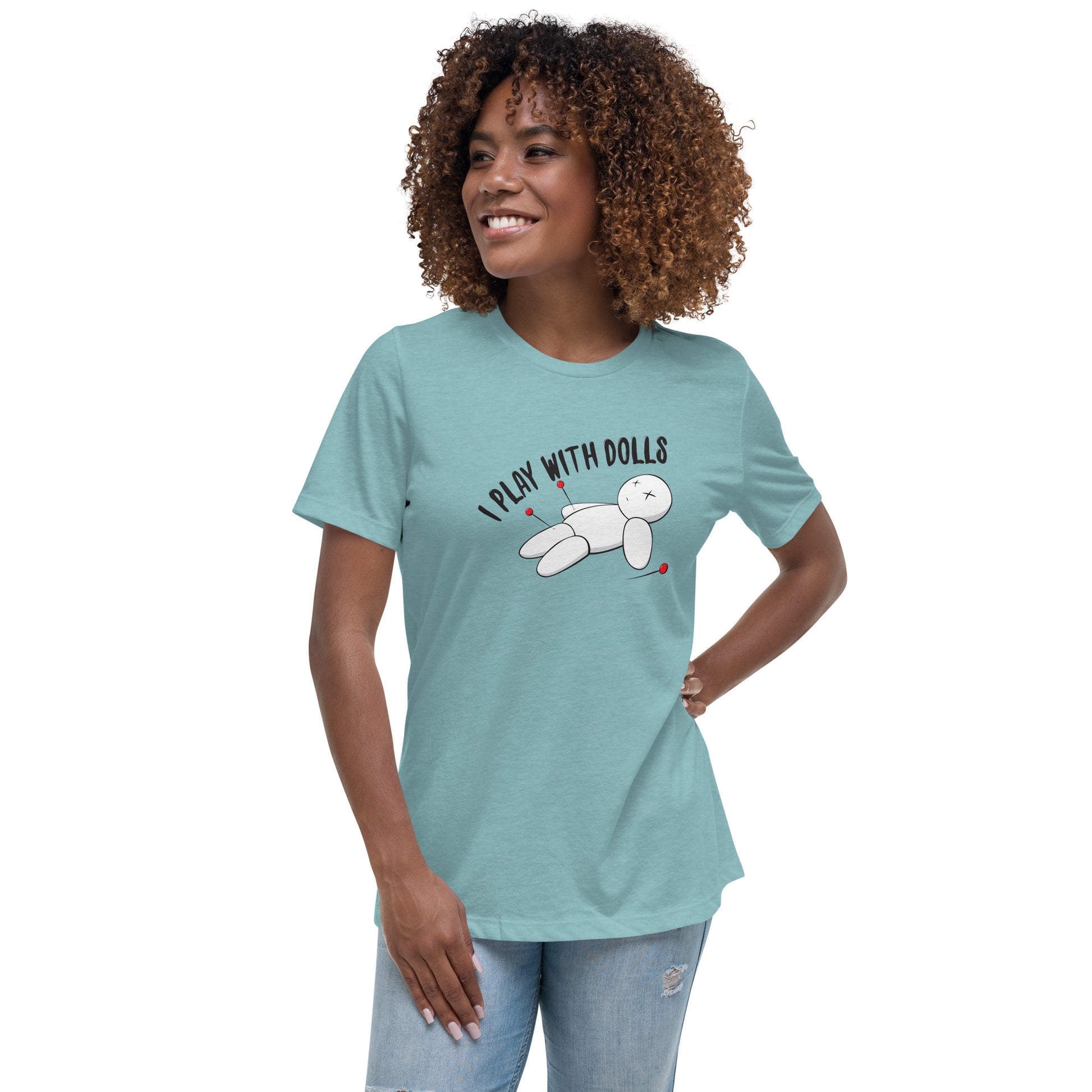 Model wearing Heather Blue Lagoon women's relaxed fit t-shirt with graphic of white voodoo doll with Xs for eyes stuck with several pins and text "I PLAY WITH DOLLS"