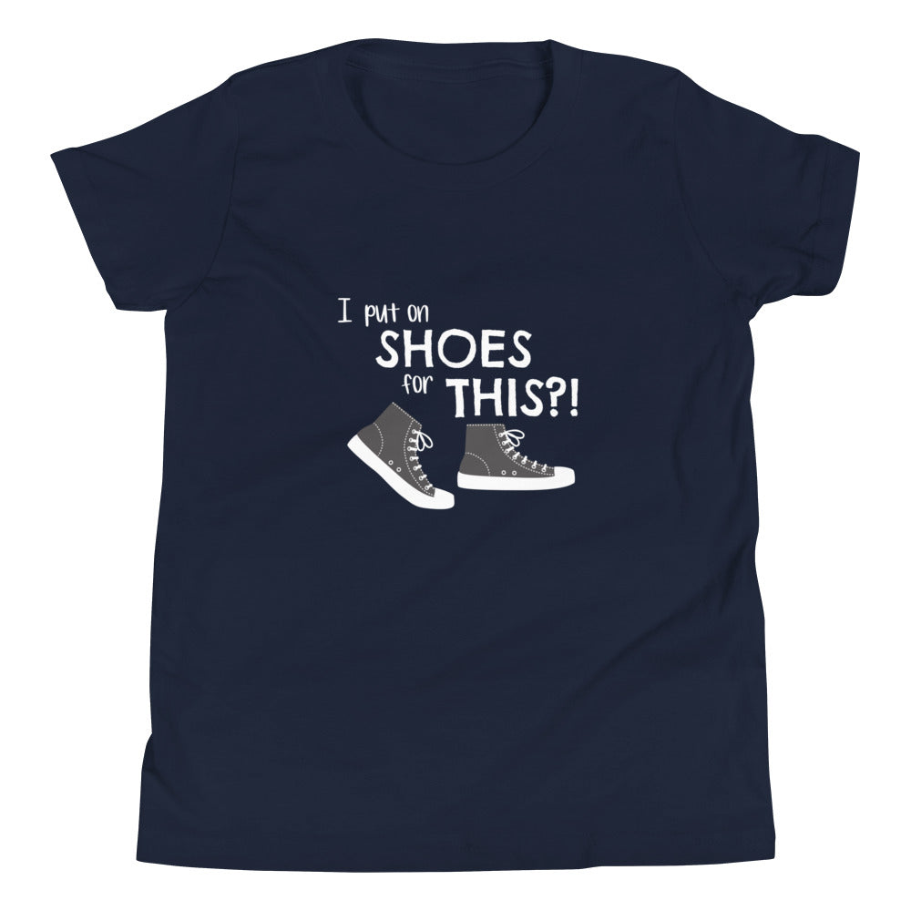 Navy youth t-shirt with graphic of black and white canvas "chuck" sneakers and text: "I put on SHOES for THIS?!"