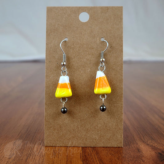 Lampwork glass orange, yellow, and white candy corn earrings with gunmetal and silver-plated base metal fittings