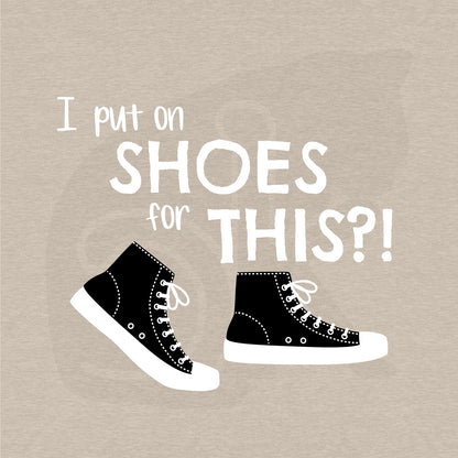 Standalone watermarked graphic of black and white canvas "chuck" sneakers and text: "I put on SHOES for THIS?!"