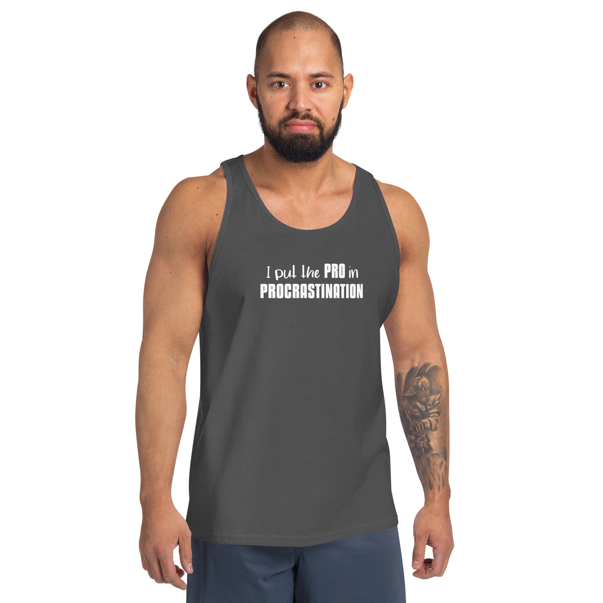 Male model wearing Asphalt unisex tank top with text graphic: "I put the PRO in PROCRASTINATION"
