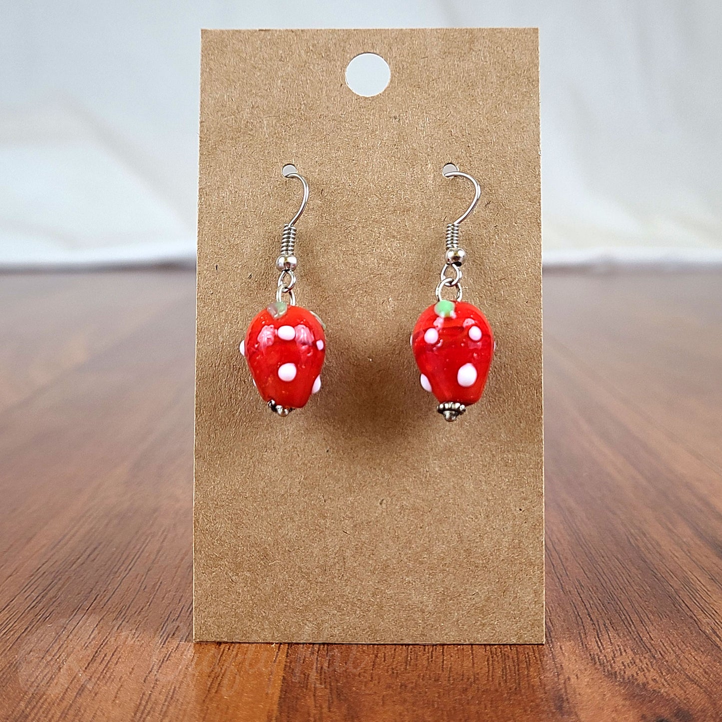 Simple drop earrings made of lampwork glass shaped like strawberries and silver-plated fittings
