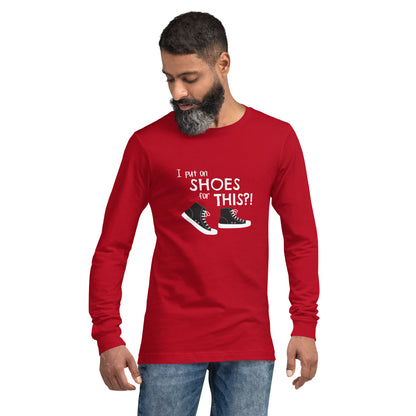 Model wearing Red long-sleeve t-shirt with graphic of black and white canvas "chuck" sneakers and text: "I put on SHOES for THIS?!"