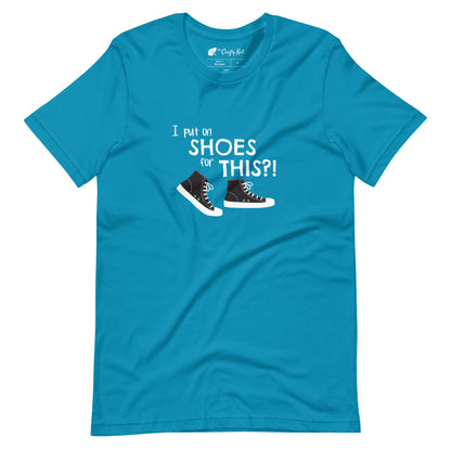 Aqua (cyan) t-shirt with graphic of black and white canvas "chuck" sneakers and text: "I put on SHOES for THIS?!"