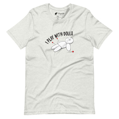 Ash (pale grey) t-shirt with graphic of white voodoo doll with Xs for eyes stuck with several pins and text "I PLAY WITH DOLLS"