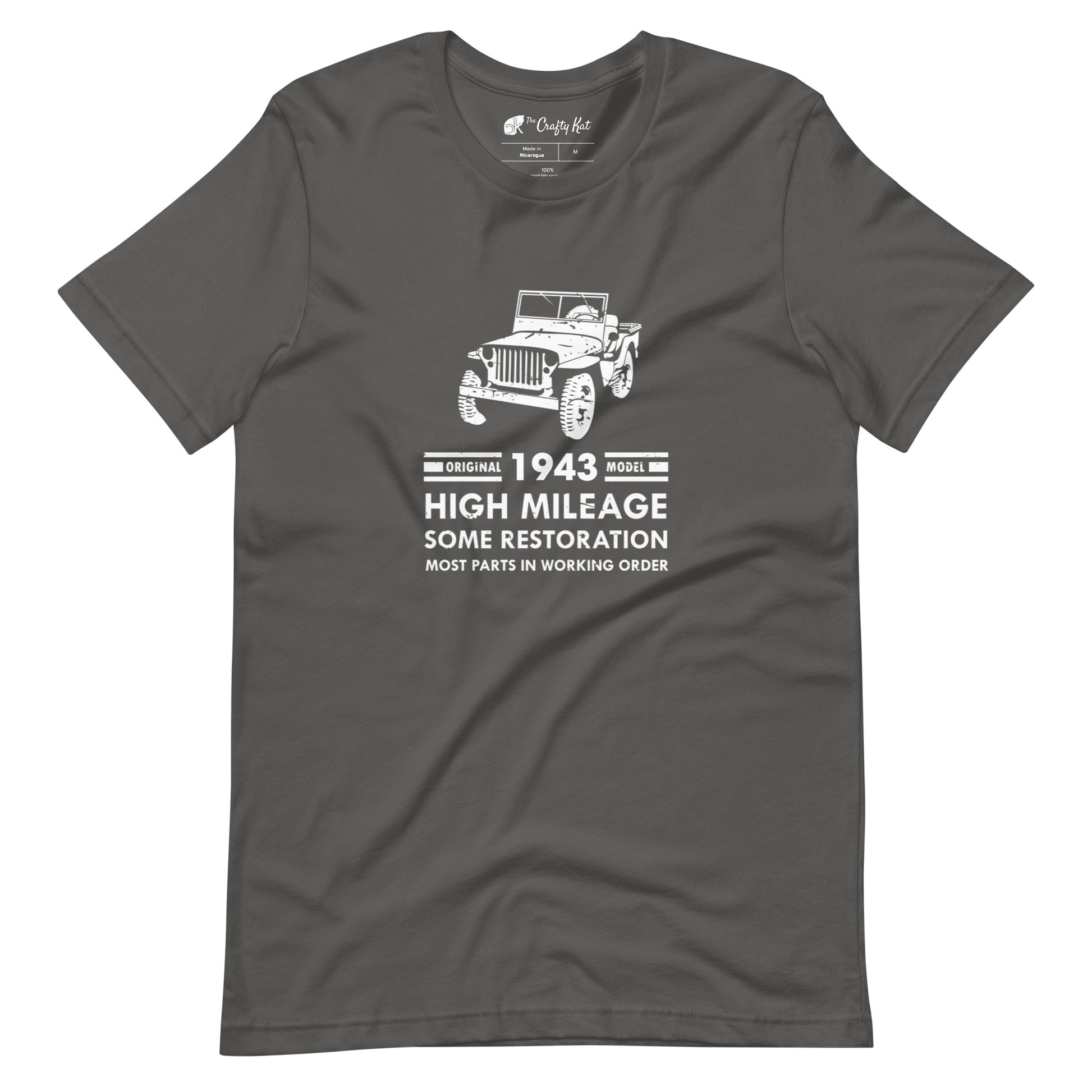 Asphalt grey t-shirt with distressed graphic of old military jeep and text "Original YEAR model HIGH MILEAGE some restoration MOST PARTS IN WORKING ORDER"