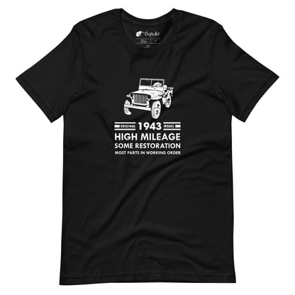 Black t-shirt with distressed graphic of old military jeep and text "Original YEAR model HIGH MILEAGE some restoration MOST PARTS IN WORKING ORDER"