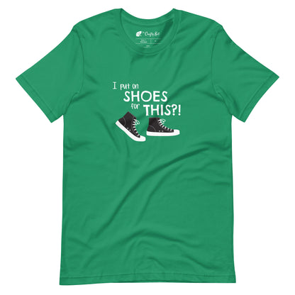 Kelly green t-shirt with graphic of black and white canvas "chuck" sneakers and text: "I put on SHOES for THIS?!"