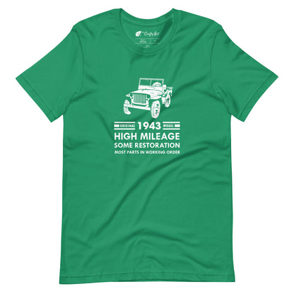 Kelly green t-shirt with distressed graphic of old military jeep and text "Original YEAR model HIGH MILEAGE some restoration MOST PARTS IN WORKING ORDER"