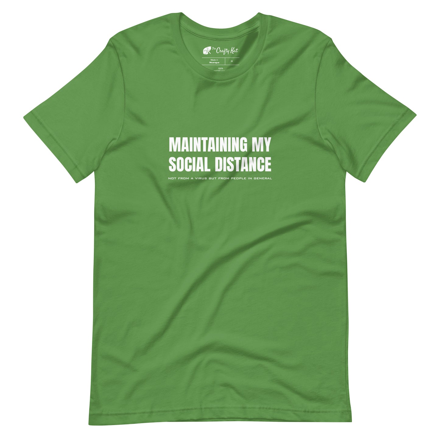 Leaf green t-shirt with white graphic: "MAINTAINING MY SOCIAL DISTANCE not from a virus but from people in general"