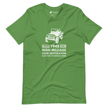 Leaf green t-shirt with distressed graphic of old military jeep and text "Original YEAR model HIGH MILEAGE some restoration MOST PARTS IN WORKING ORDER"