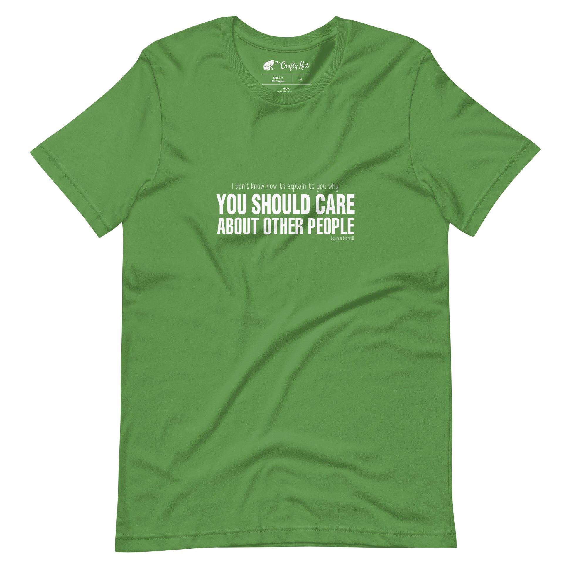Leaf green t-shirt with quote by Lauren Morrill: "I don't know how to explain to you why YOU SHOULD CARE ABOUT OTHER PEOPLE"