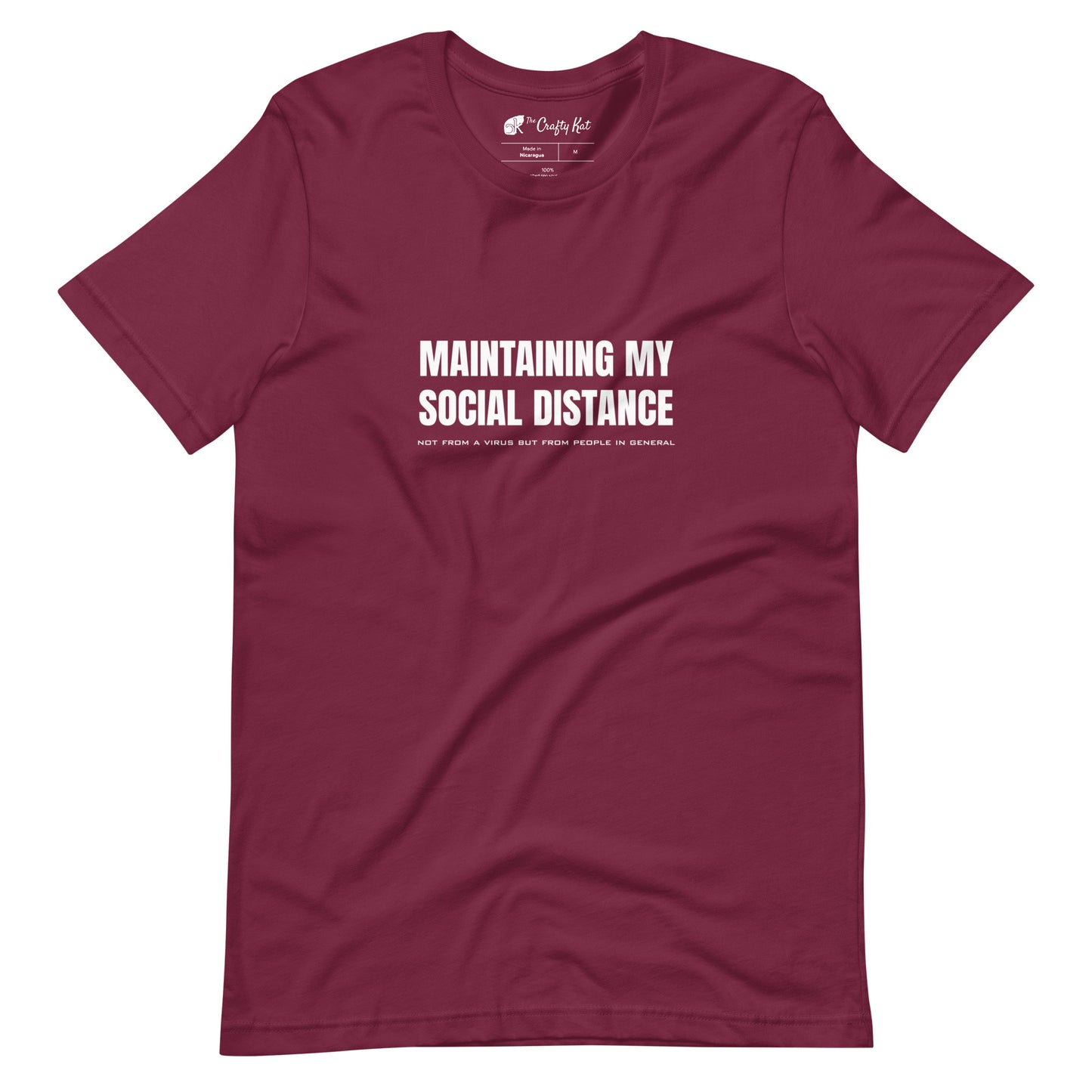 Maroon t-shirt with white graphic: "MAINTAINING MY SOCIAL DISTANCE not from a virus but from people in general"