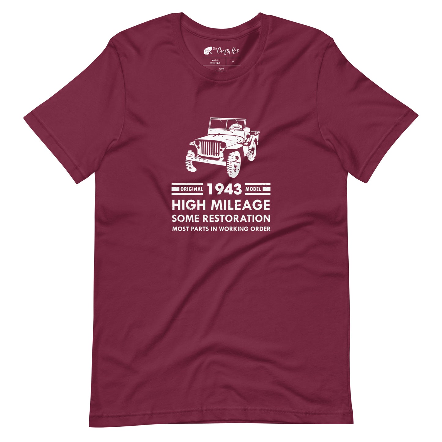 Maroon t-shirt with distressed graphic of old military jeep and text "Original YEAR model HIGH MILEAGE some restoration MOST PARTS IN WORKING ORDER"
