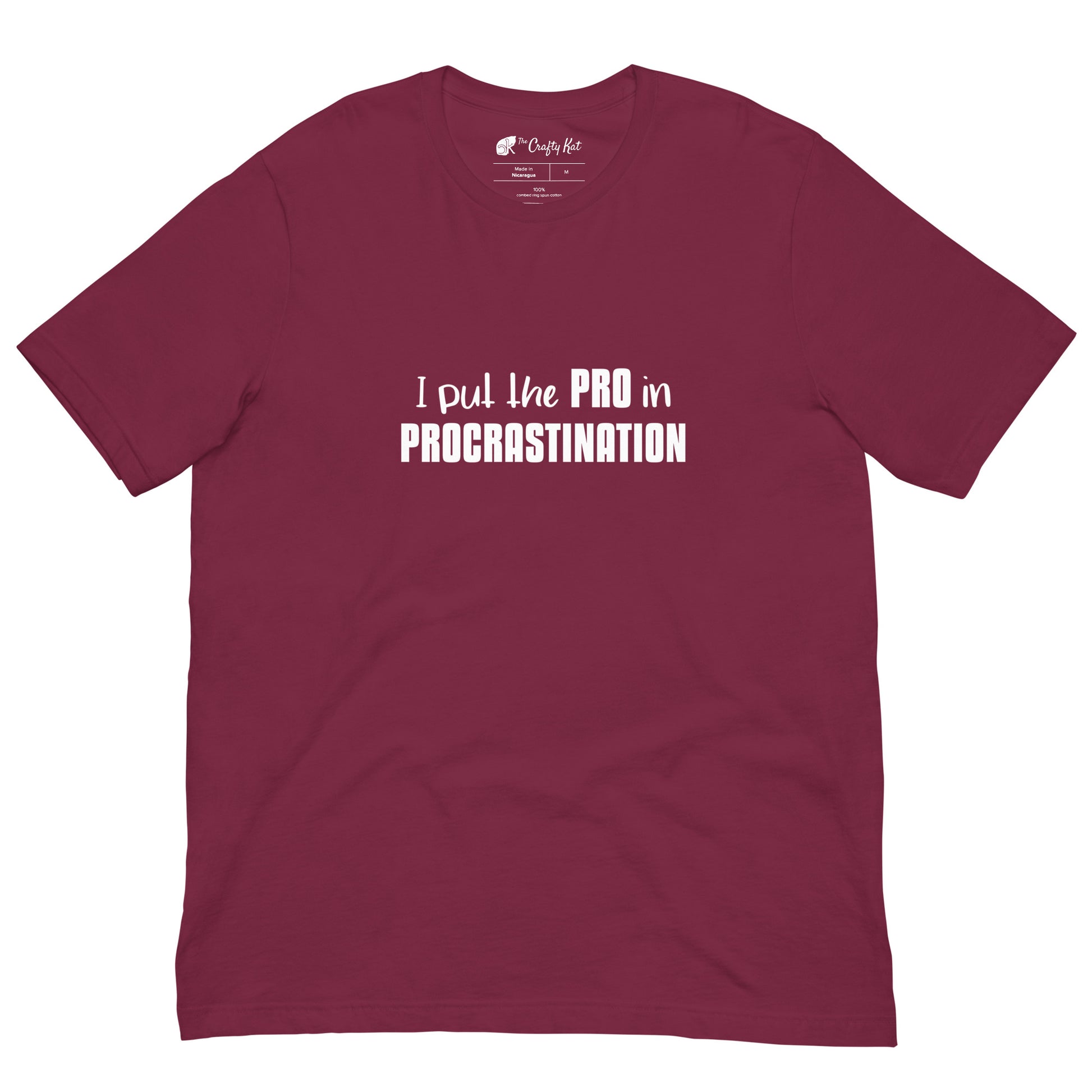 Maroon unisex t-shirt with text graphic: "I put the PRO in PROCRASTINATION"