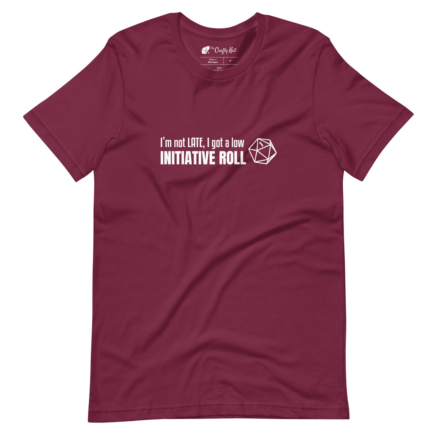 Maroon unisex t-shirt with a graphic of a d20 (twenty-sided die) showing a roll of "1" and text: "I'm not LATE, I got a low INITIATIVE ROLL"