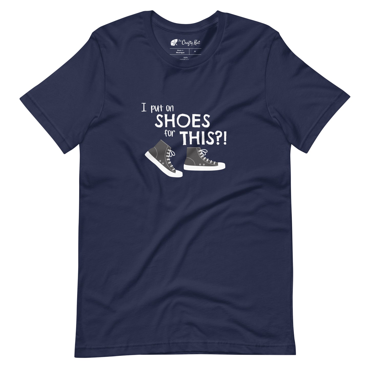 Navy t-shirt with graphic of black and white canvas "chuck" sneakers and text: "I put on SHOES for THIS?!"