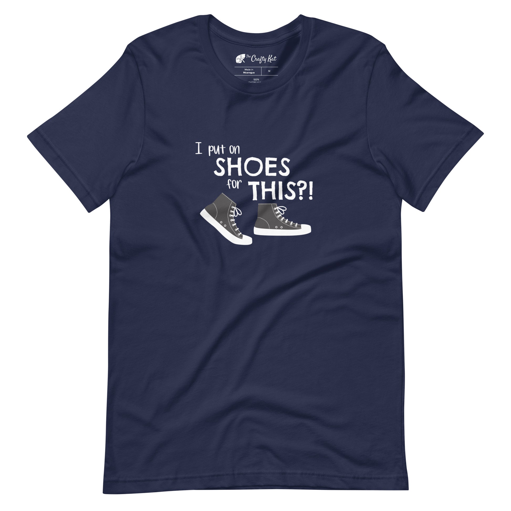 Navy t-shirt with graphic of black and white canvas "chuck" sneakers and text: "I put on SHOES for THIS?!"