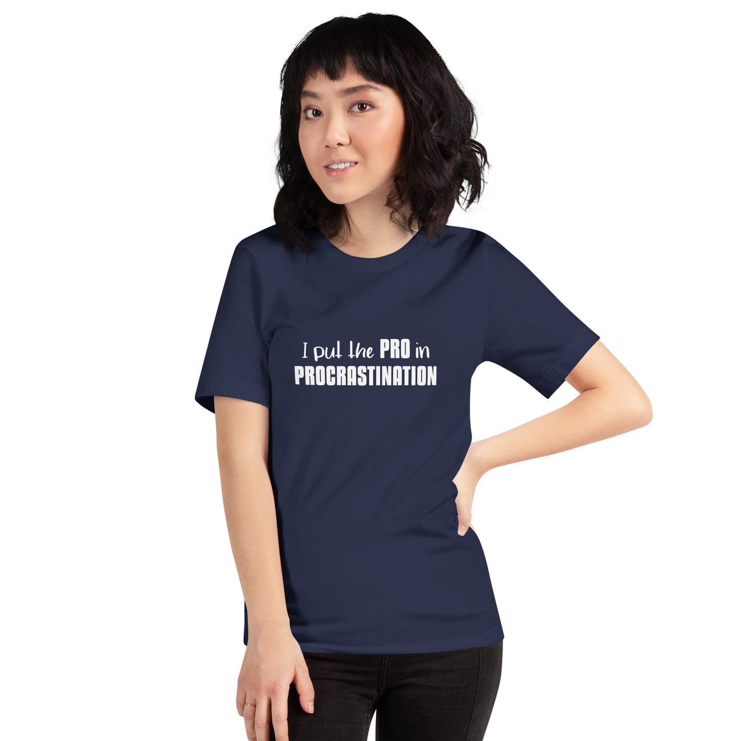 Female model wearing Navy unisex t-shirt with text graphic: "I put the PRO in PROCRASTINATION"