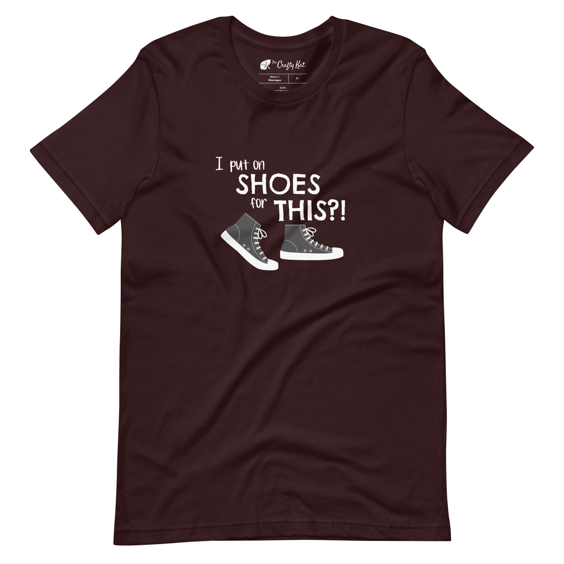 Oxblood Black t-shirt with graphic of black and white canvas "chuck" sneakers and text: "I put on SHOES for THIS?!"