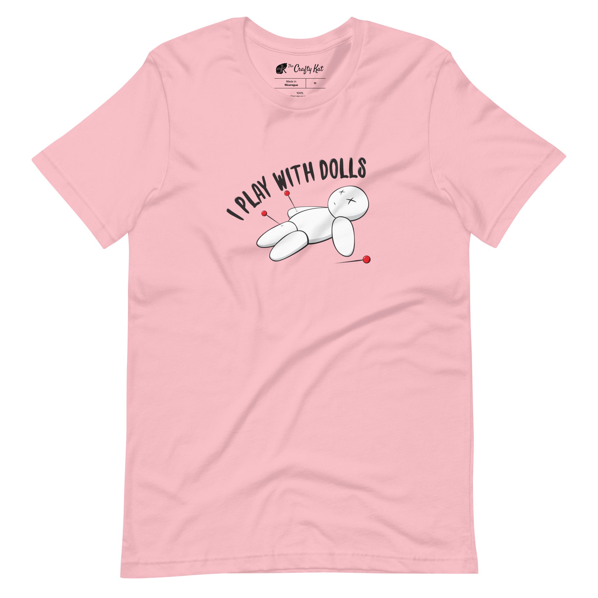Pink t-shirt with graphic of white voodoo doll with Xs for eyes stuck with several pins and text "I PLAY WITH DOLLS"
