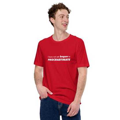 Male model wearing a red t-shirt with text graphic: "I have not yet BEGUN to PROCRASTINATE"