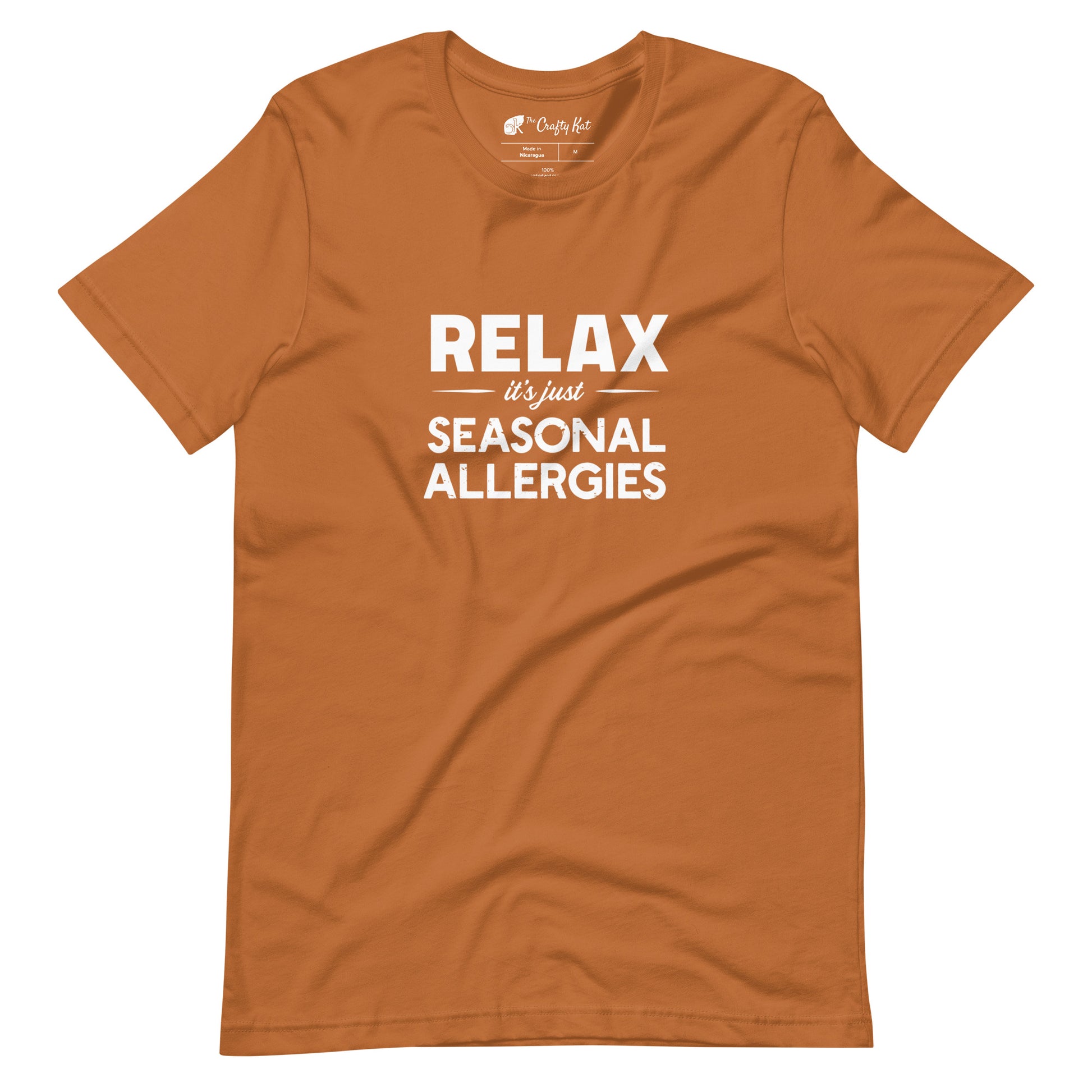 Toast (yellow orange) t-shirt with white graphic: "RELAX it's just SEASONAL ALLERGIES"