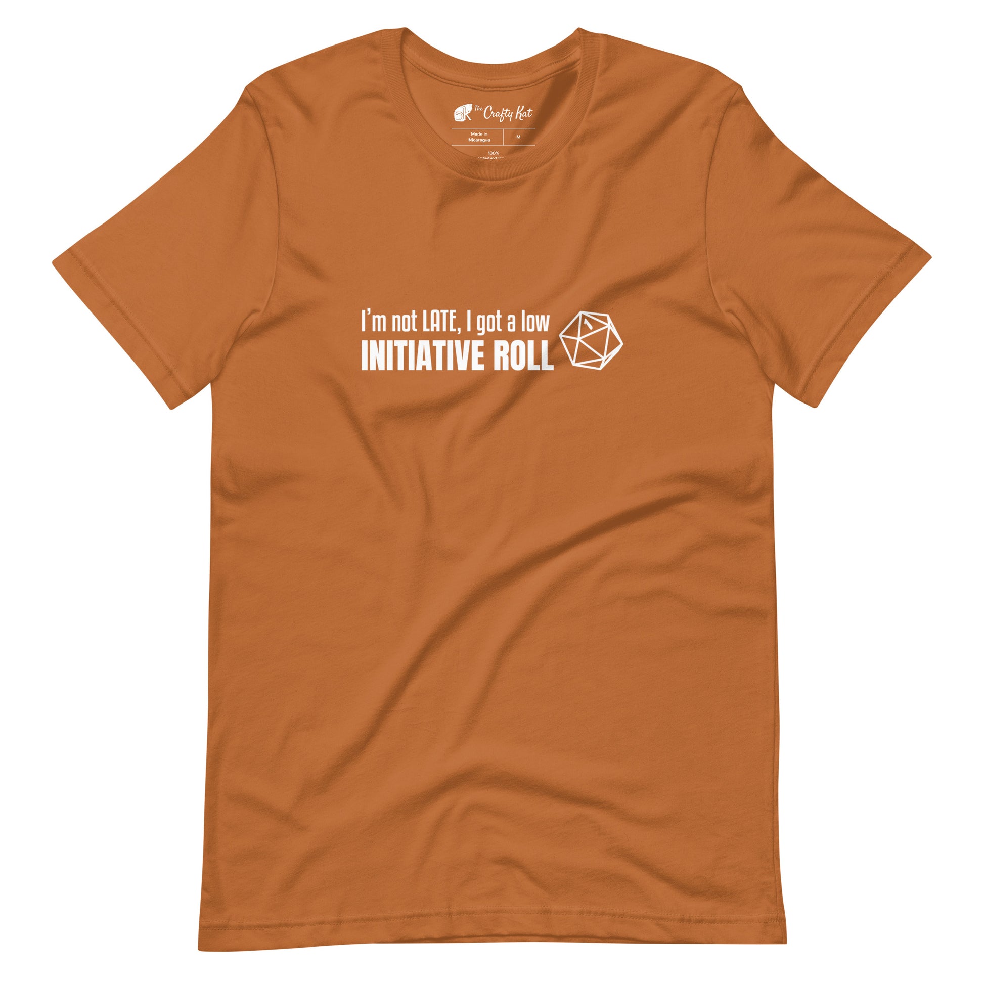 Toast (light orange) unisex t-shirt with a graphic of a d20 (twenty-sided die) showing a roll of "1" and text: "I'm not LATE, I got a low INITIATIVE ROLL"