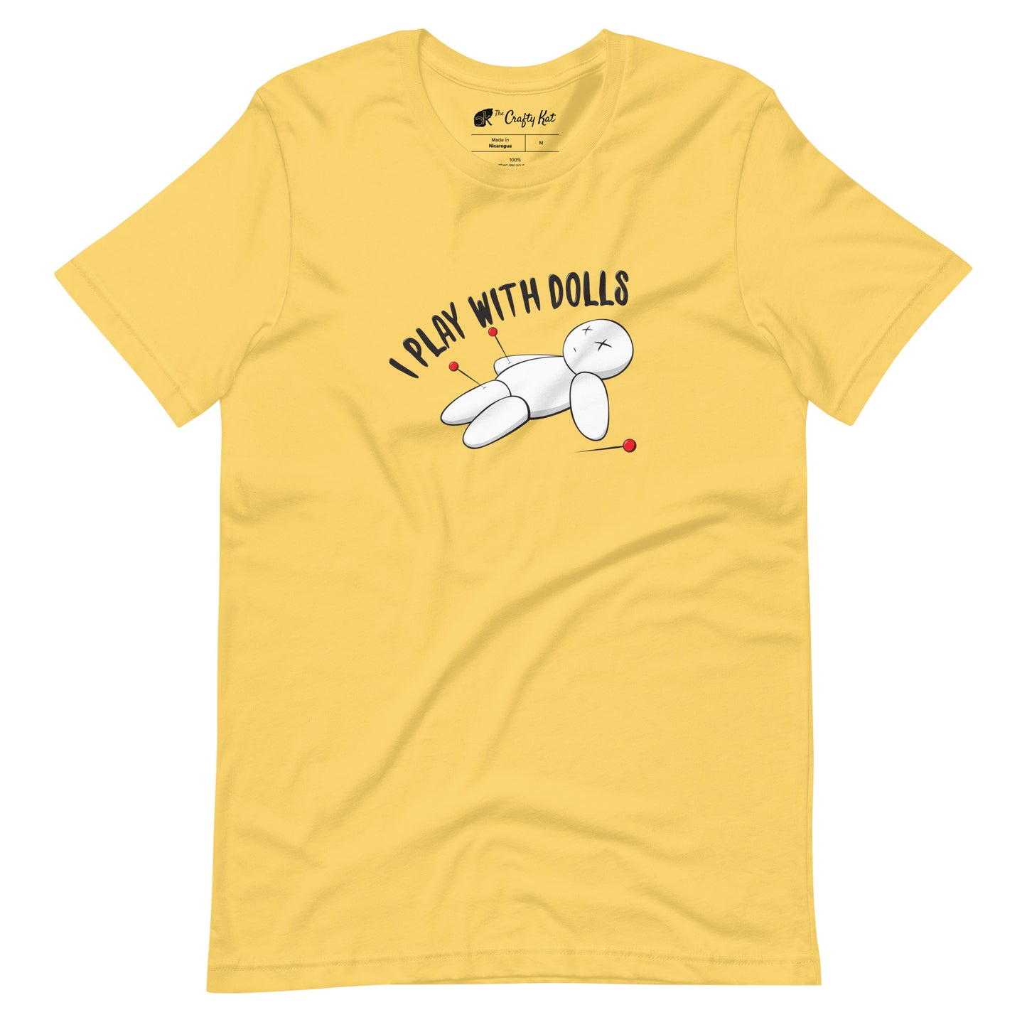 Yellow t-shirt with graphic of white voodoo doll with Xs for eyes stuck with several pins and text "I PLAY WITH DOLLS"
