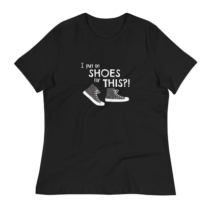 Black women's relaxed fit t-shirt with graphic of black and white canvas "chuck" sneakers and text: "I put on SHOES for THIS?!"