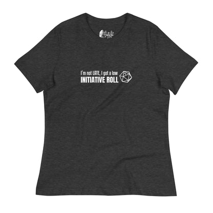 Dark Grey Heather women's relaxed-fit t-shirt with a graphic of a d20 (twenty-sided die) showing a roll of "1" and text: "I'm not LATE, I got a low INITIATIVE ROLL"