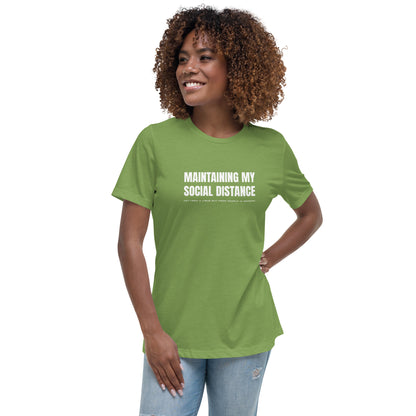 Model wearing Leaf green women's relaxed fit t-shirt with white graphic: "MAINTAINING MY SOCIAL DISTANCE not from a virus but from people in general"