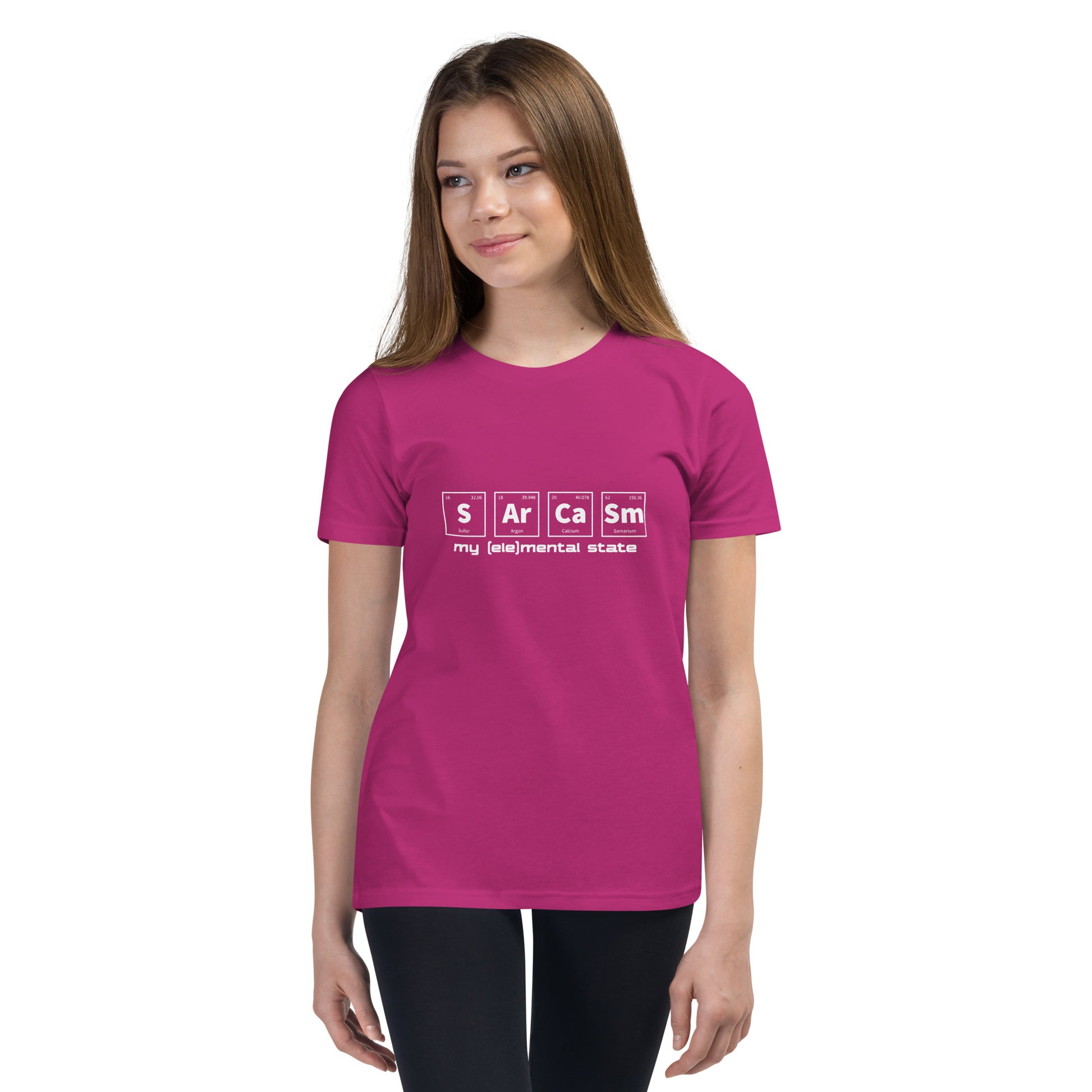 Model wearing Berry (hot pink) youth t-shirt with graphic of periodic table of elements symbols for Sulfur (S), Argon (Ar), Calcium (Ca), and Samarium (Sm) and text "my (ele)mental state"