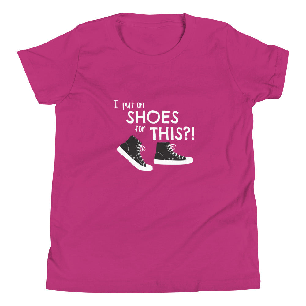 Berry (hot pink) youth t-shirt with graphic of black and white canvas "chuck" sneakers and text: "I put on SHOES for THIS?!"