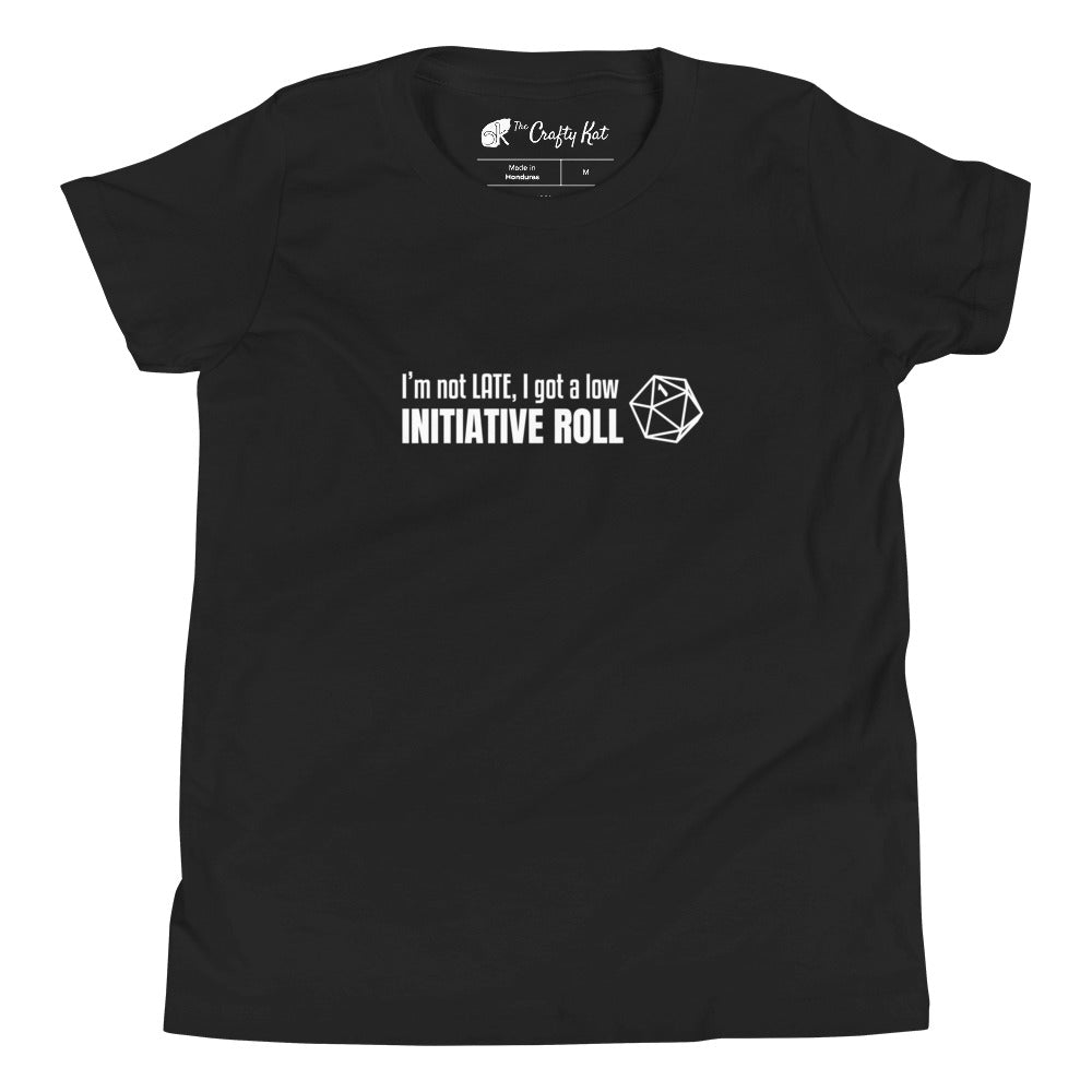 Black youth t-shirt with a graphic of a d20 (twenty-sided die) showing a roll of "1" and text: "I'm not LATE, I got a low INITIATIVE ROLL"