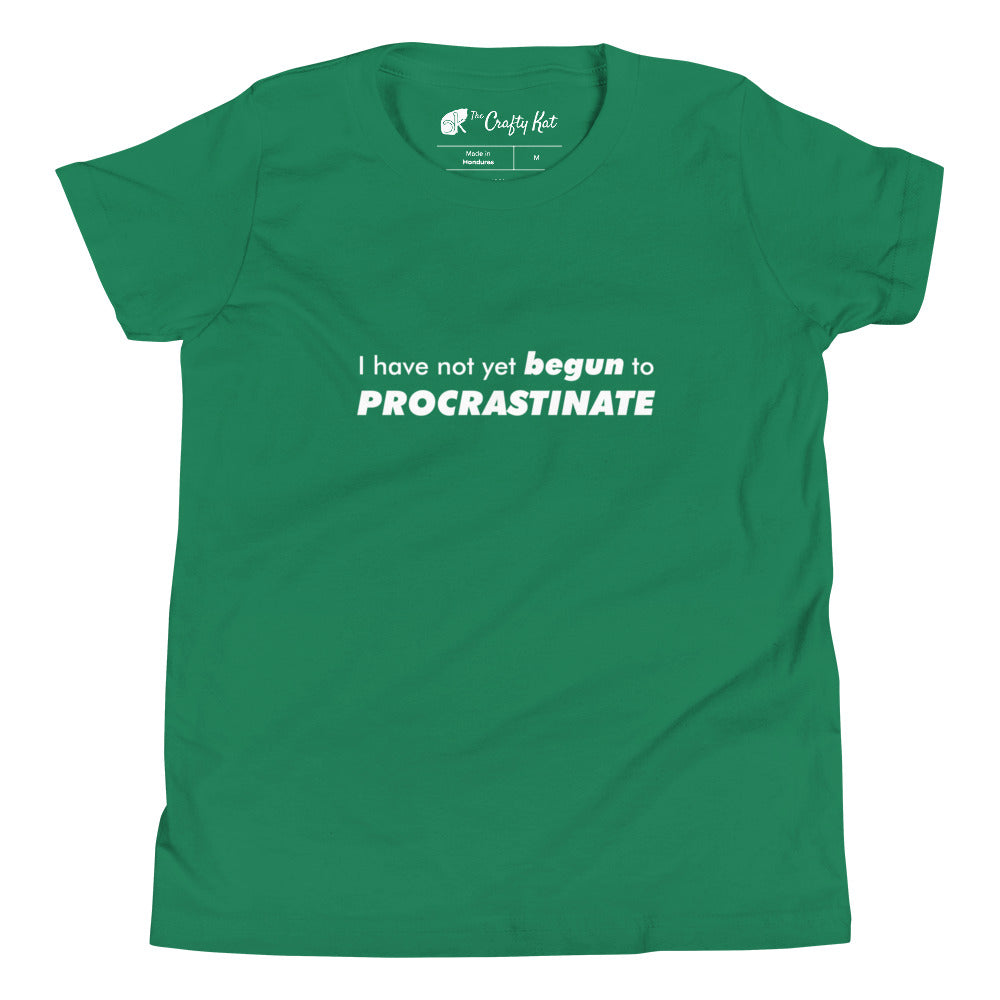 Kelly green youth t-shirt with text graphic: "I have not yet BEGUN to PROCRASTINATE"