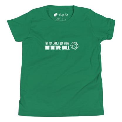 Kelly green youth t-shirt with a graphic of a d20 (twenty-sided die) showing a roll of "1" and text: "I'm not LATE, I got a low INITIATIVE ROLL"