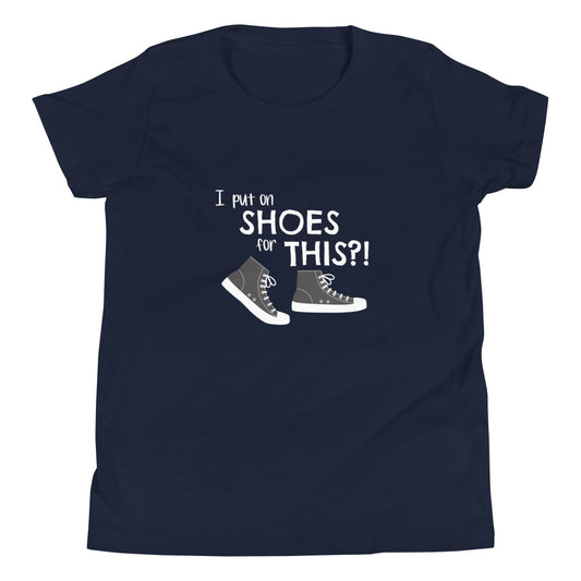 Navy youth t-shirt with graphic of black and white canvas "chuck" sneakers and text: "I put on SHOES for THIS?!"